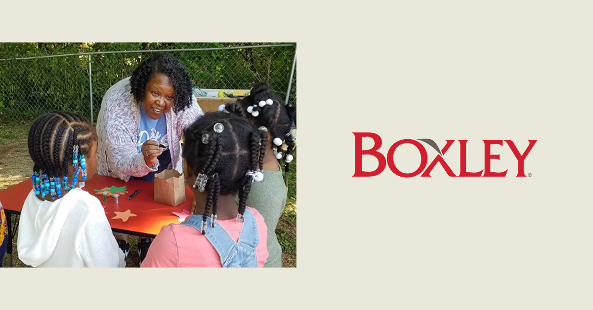 Boxley asphalt employee helping children