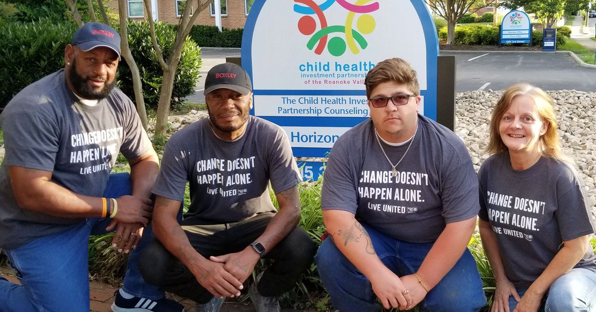 Boxley Employees Posing in Front of CHIP Sign